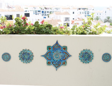 These circular handmade tiles make unique wall hangings for kitchens, bathrooms or outdoor wall art. Our aqua and white decorative tiles can also be combined with our other circular tiles to make larger wall art installations.