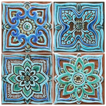 Turquoise handmade tile with decorative relief. Decorative tile handmade in Spain.