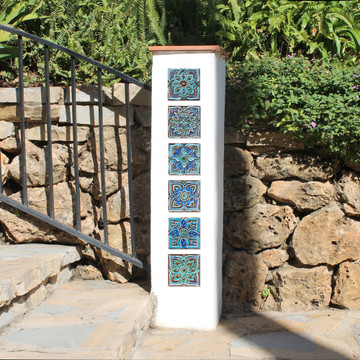 Turquoise handmade tile with decorative relief. Decorative tile handmade in Spain.