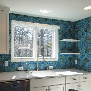 Kitchen backsplash. Turquoise handmade tile with decorative relief. Large decorative tile with Mandala design.