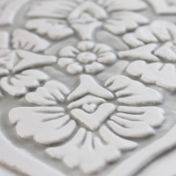 Handmade tile for kitchens, bathrooms and outdoor wall art. Decorative tile handmade in Spain. Relief tile glazed in grey and white.