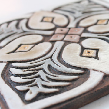 These handmade tiles make wonderful wall hangings and outdoor wall art.  Matt brown decorative tile handmade in Spain.