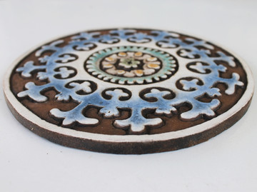 These circular handmade tiles make unique wall hangings for kitchens, bathrooms or outdoor wall art. Our decorative tiles can also be combined with our other circular tiles to make larger wall art installations.