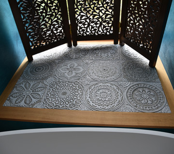 Handmade tiles used in seating area of window.  Decorative tiles handmade in Spain. Beige & white relief tiles.