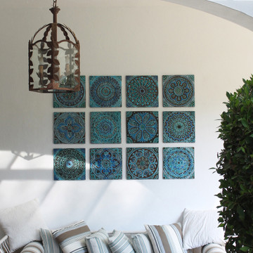 Outdoor wall art. Turquoise handmade tile with decorative relief. Large decorative tile with mandala design.