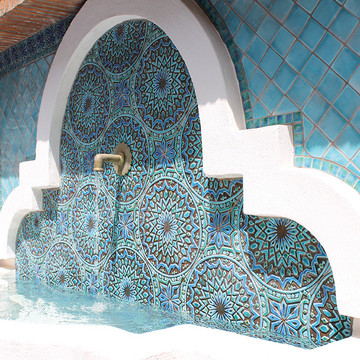 Ceramic fountain. Turquoise handmade tile with decorative relief. Large decorative tile with mandala design.