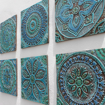 Outdoor wall art. Turquoise handmade tile with decorative relief. Large decorative tile with mandala design.