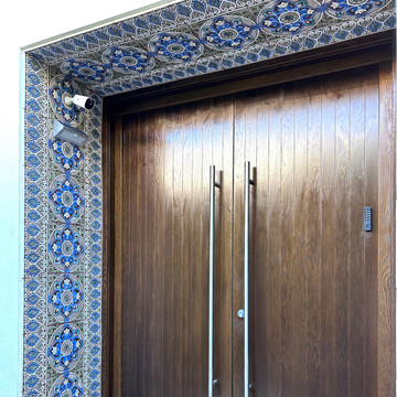 Tile panelling for doorway using ceramic tiles carved with relief. Spanish tile for kitchens, bathrooms and wall art. Handmade in Spain.