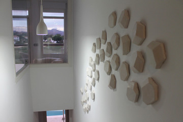 Ceramic mural made with Handmade tiles.  Custom designed ceramic wall art installation, handmade in Spain.