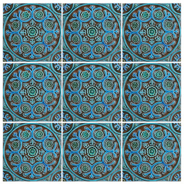 Turquoise handmade tile with decorative relief. Large decorative tile with Suzani design.