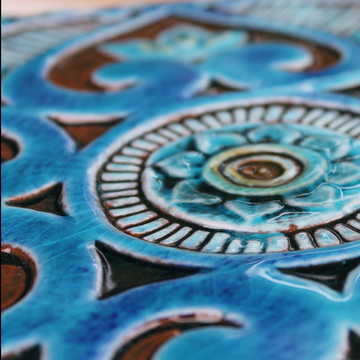 Handmade tiles glazed in turquoise