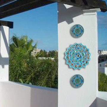 These handmade tiles make unique wall art for kitchens and bathrooms. Our decorative turquoise circle tiles make wonderful outdoor wall art, perfect for garden or terrace walls.