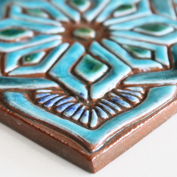 Turquoise moroccan handmade tile with decorative relief. Decorative tile handmade in Spain.