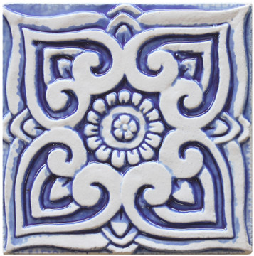 Blue and white handmade tile with relief for kitchens, bathrooms and outdoor wall art. Decorative tile handmade in Spain.