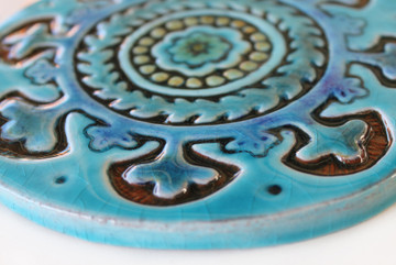 These circular handmade tiles make unique wall hangings for kitchens, bathrooms or outdoor wall art. Our turquoise decorative tiles can also be combined with our many other circular tiles to make larger wall art installations.