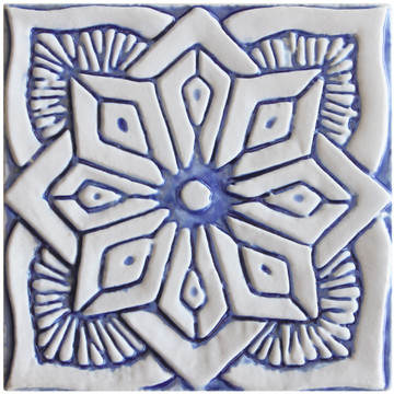 Blue and white handmade tile with relief for kitchens, bathrooms and outdoor wall art. Decorative tile handmade in Spain.