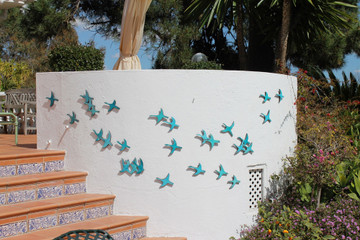 Bird wall art for homes and gardens.. Create your unique wall art installation with our ceramic bird figurines.