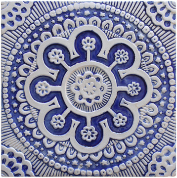 Blue and white handmade tile with relief. Decorative tile handmade in Spain.