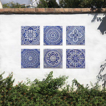 Outdoor wall art with blue and white handmade tile with relief. Decorative tile handmade in Spain.