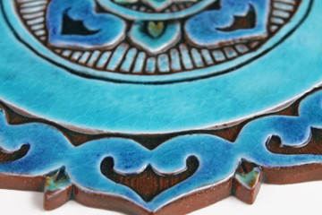 These handmade tiles are glazed in turquoise and make unique wall hangings for kitchens and bathrooms. Our decorative tiles also make wonderful outdoor wall art.  Circle garden decor handmade in Spain.