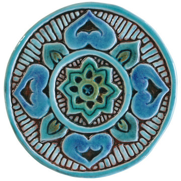 These handmade tiles make a unique wall art installation.  Our decorative tiles make wonderful outdoor wall art, either on a garden column or home entrance. Turquoise circle garden decor handmade in Spain.