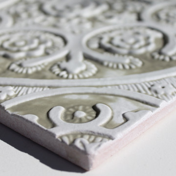 Handmade tile for kitchens, bathrooms and outdoor wall art. Decorative tile handmade in Spain. Relief tile glazed in beige and white.