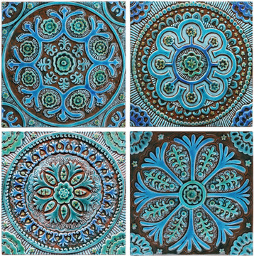 Turquoise handmade tile with decorative relief. Large decorative tile with Suzani design.