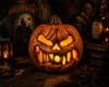Glowing evil jack o lantern Halloween decoration on rustic haunted tabletop with vintage Halloween decor and candles