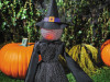 Black mesh witch figure with pointed hat and battery-powered glowing head