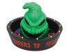 Sinister Oogie Boogie face peeking over candy bowl with glowing edge