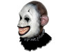 Creepy monkey clown mask front view with hollow black eyes, oversized ears, and sinister smiling mouth