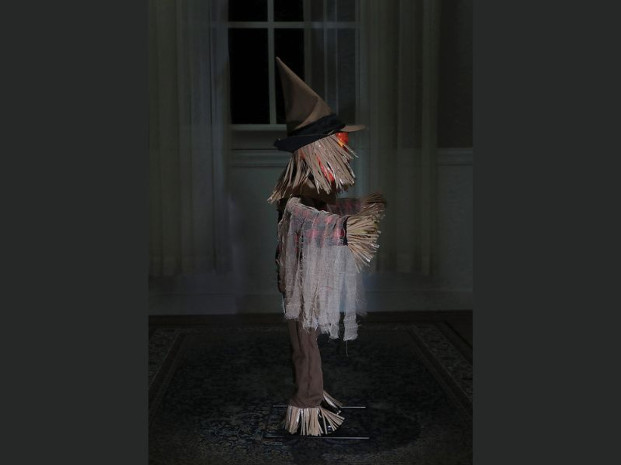 36" Twitching Scarecrow Animated Prop: Arms Wave back and forth, Head w/ yellow Light-up eyes turns, Orange Pumpkin Face w/ jagged mouth moves & speaks.