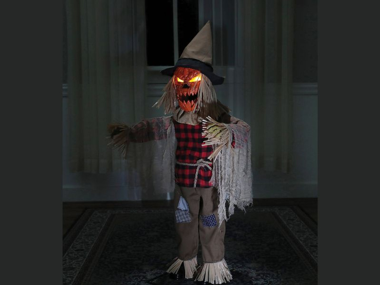 36" Twitching Scarecrow Animated Prop: Arms Wave back and forth, Head w/ yellow Light-up eyes turns, Orange Pumpkin Face w/ jagged mouth moves & speaks.