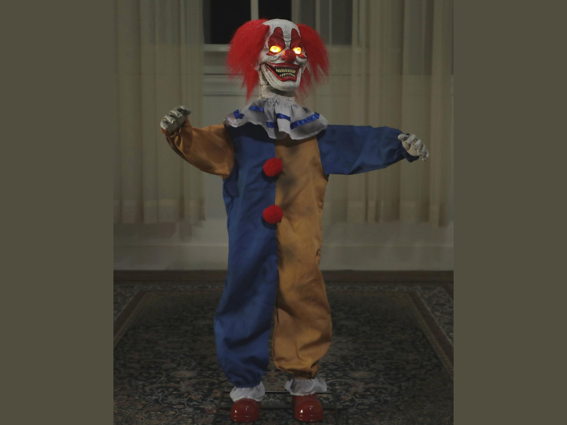 little top clown animated halloween prop with glowing eyes

Step right up and make your way to the funniest creepy clown ever! This 36-inch Little Top Clown Animated Prop will make all your guests roar with laughter! His arms wave back and forth, his head with yellow light-up eyes turns and his wide colorful mouth moves while he speaks 4 different hilarious phrases:

Saying #1: "Step right up kiddies, we've got the craziest place in town right here hahaha..."

Saying #2: "You do like the circus don't you? You better like clowns otherwise I might just go Craazzzy!"

Saying #3: "Who wants to play a funny little trick tonight, haha, jokesters are all welcome here. I might have a trick for you, so you better not turn your back on me hahah"

Saying #4: "You aren't frightened of clowns are you? haha, we think everything is funny.. even your fear of us haha... So go ahead and be scared I could use a good laugh haha!"

He is made of an injection molded and blow molded plastic frame with bendable wire arms. His bright circus clown fabric costume contrasts nicely with his wild red clown hair. Motion Activated with a Try-me option. Requires 3 x AA batteries (not included).

Features:

Half-pint animated clown with matte red hair and putrid decomposing teeth that open and close with every word

Set on a sturdy solid metal stand that is not easily tipped over

Hands and head move side to side, as a variety of phrases bellow from this disturbed clown

Clothed in a stained clown suit that highlights his abhorrent appearance