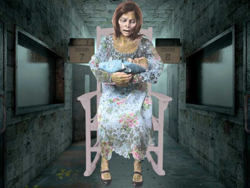 a person sitting in a rocking chair holding a baby