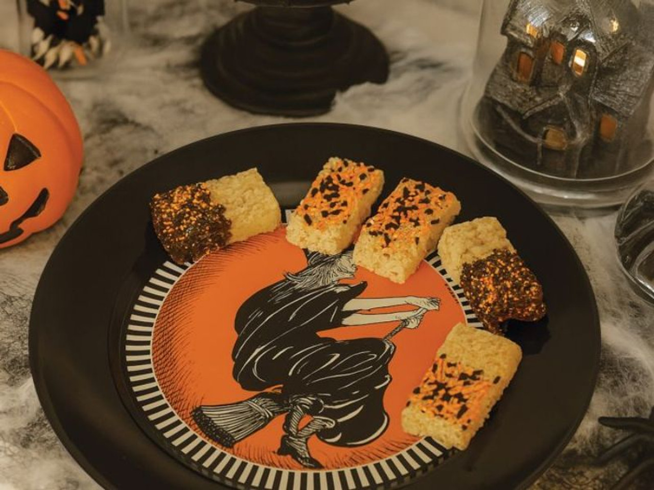 Retro Halloween serving plate featuring flying witch illustration