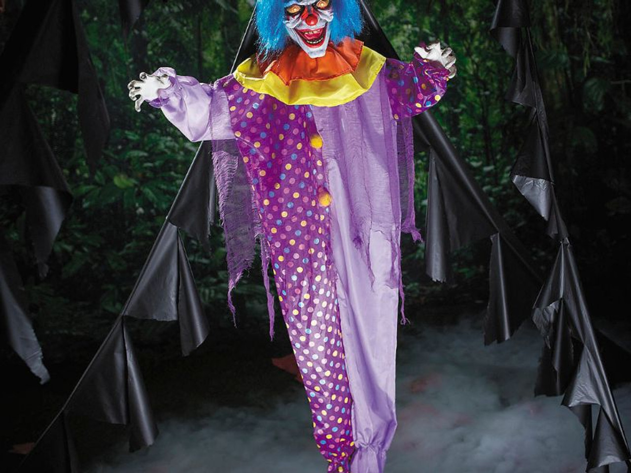 creepy circus clown prop standing in haunted house setting