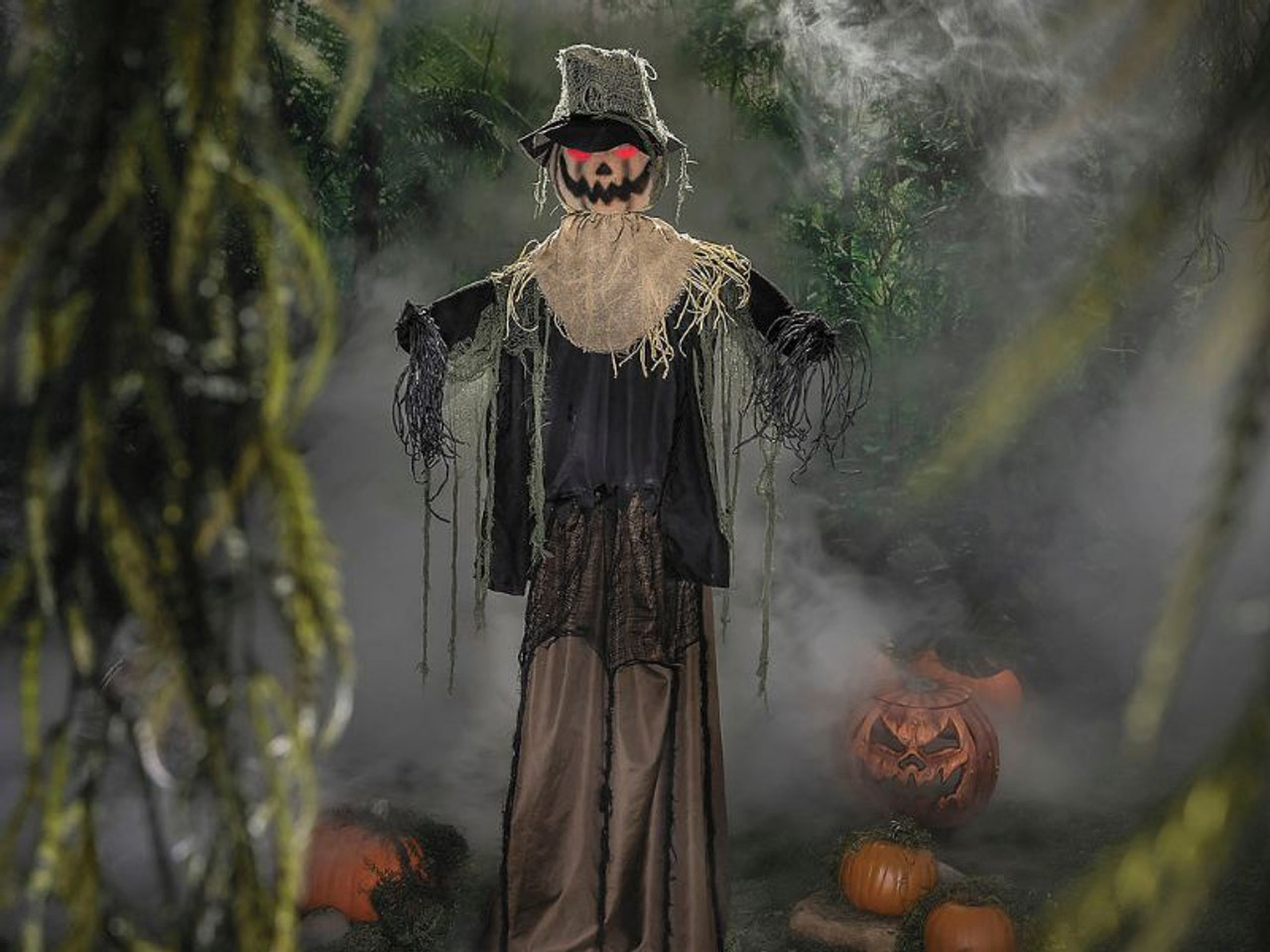 Life-size scarecrow Halloween prop standing in spooky yard