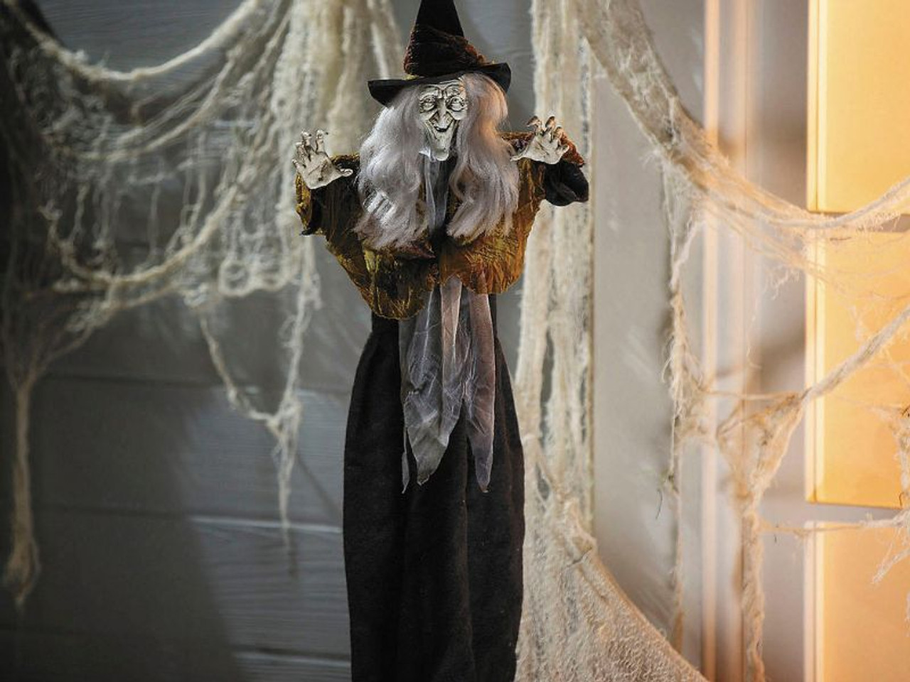 27 inch hanging Halloween witch with gray hair and dark dress