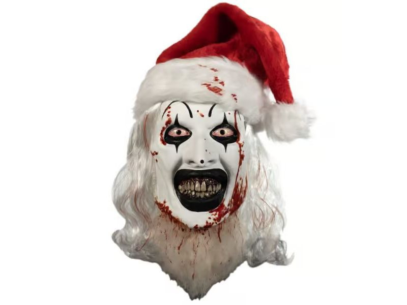 A creepy clown mask with white face paint, black clown makeup around the eyes, red-rimmed eyes, and blood splatters, wearing a Santa hat.