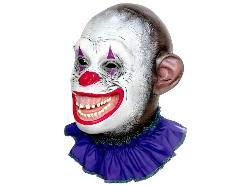 Creepy circus ape clown mask with wide grin, white face paint, purple triangles, and vintage sideshow style
