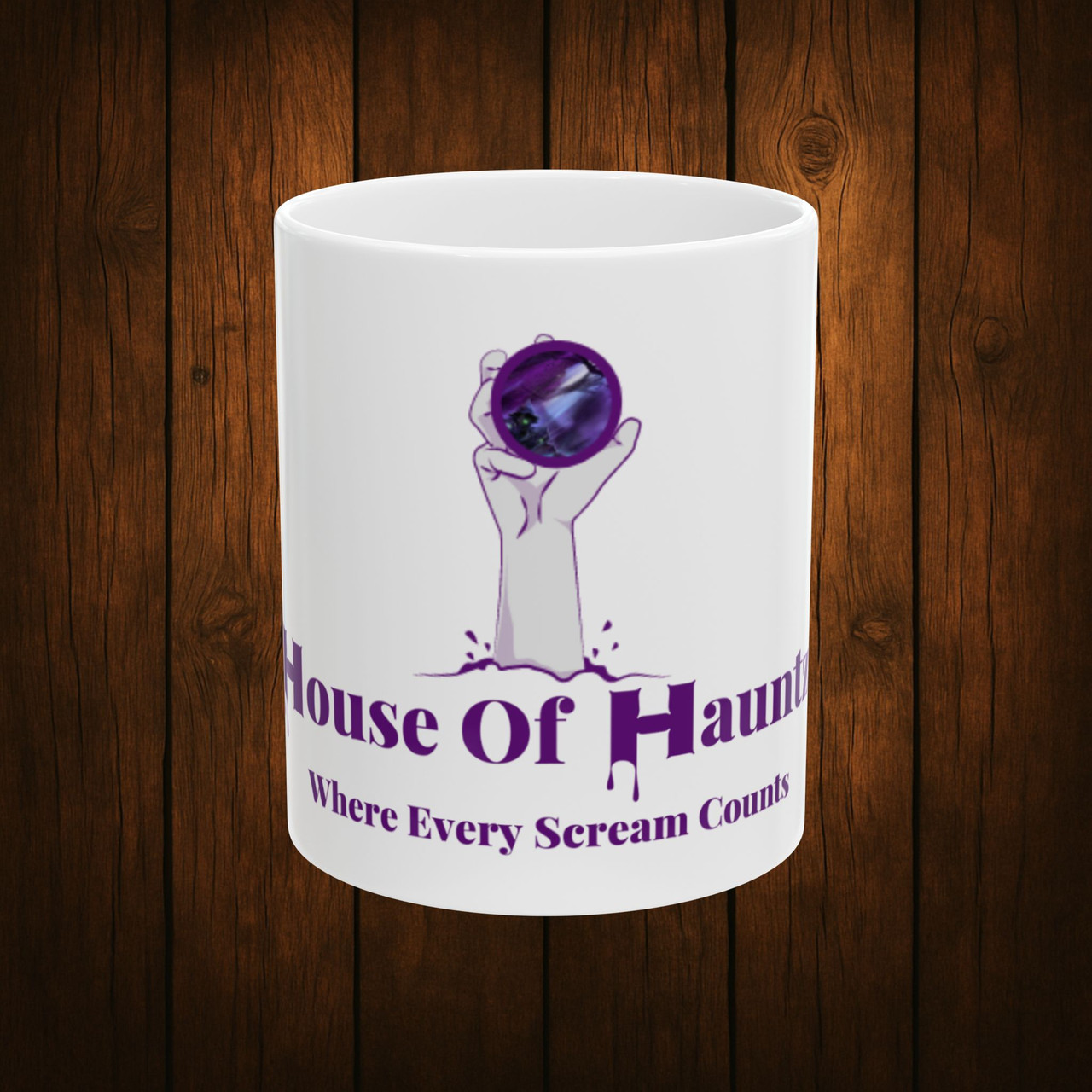 11oz House of Hauntz Halloween ceramic mug with spooky crystal ball hand logo