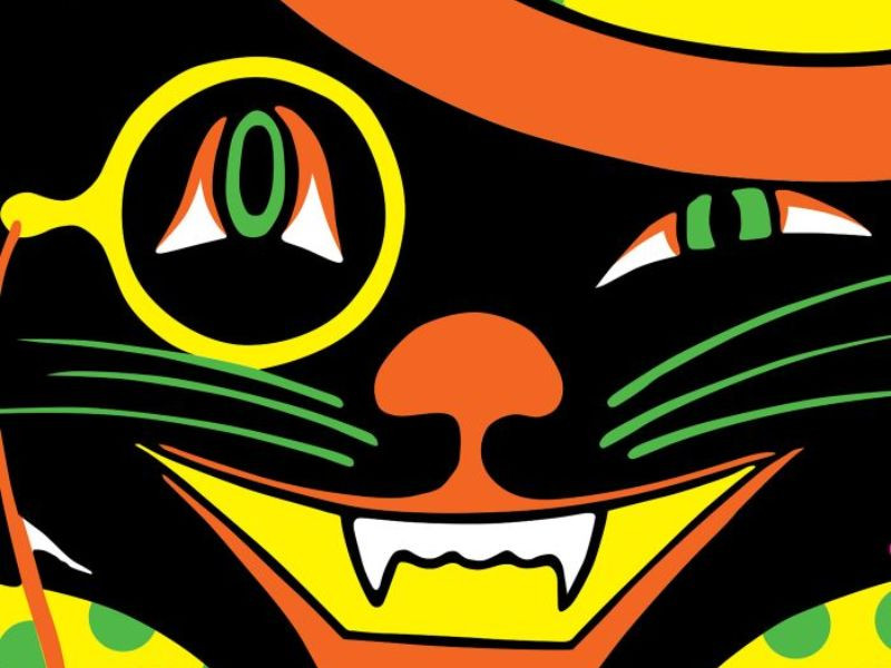 A black cat with a monocle and top hat smiles broadly with visible fangs.