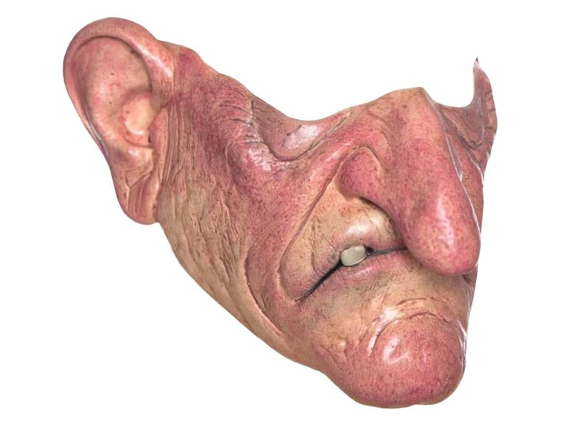 Three Tinsley Transfers horror half masks arranged in freakshow carnival themed collection