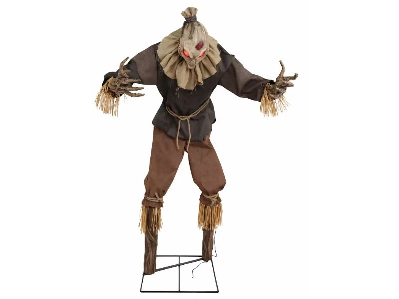 haunted house scarecrow prop with glowing eyes and branch hands