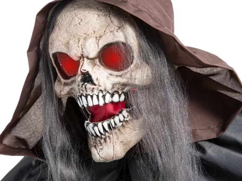 creepy skeleton reaper with lantern halloween decor