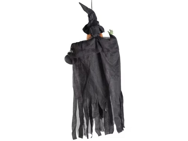 green witch holding cauldron spooky decoration
