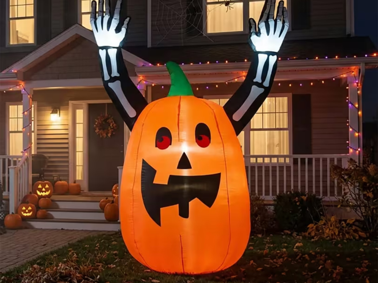 light up pumpkin inflatable with skeleton arms outdoor
