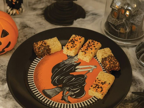 Retro Halloween serving plate featuring flying witch illustration