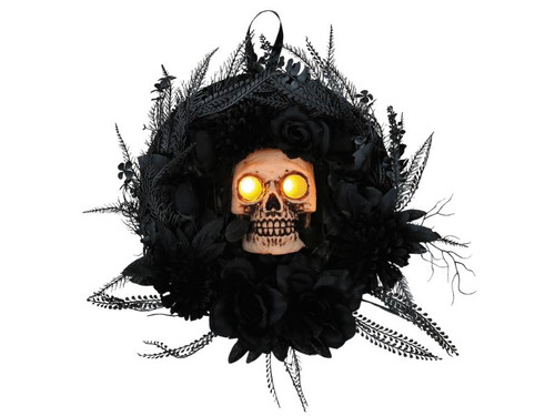 black Halloween wreath with light-up skull centerpiece